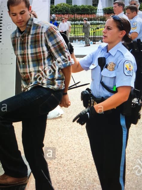 Female Police Officer With Her Prisoner