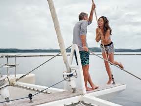 a couple on a catamaran having fun
