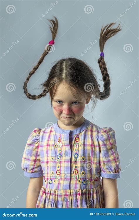 Sad Girl With Pigtails Under The Tree Royalty Free Stock Photography