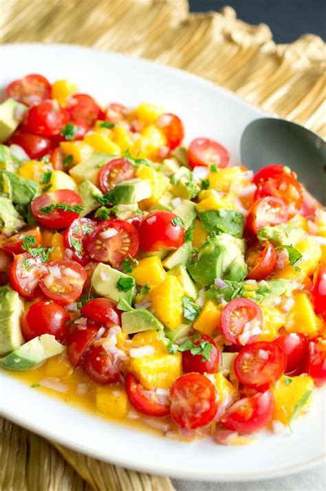 This easy, homemade salsa is perfect for salmon, fish tacos, chicken, and of course, dipping with chips! Mango Avocado Salsa Recipe | Delicious Meets Healthy