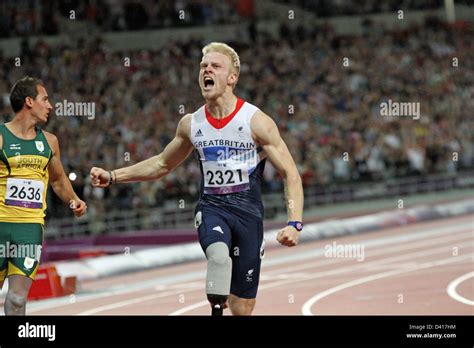 Jonnie Peacock Of Gb Celebrates Winning The Gold Medal In The Mens