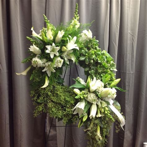 We work closely with specially chosen, trusted local florists to ensure flowers are of the highest quality. Wreath with white lilies,snapdragons ,stock and calla ...