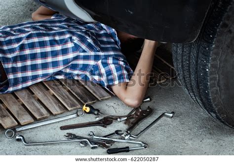 Mechanic Lying Down Working Under Front Stock Photo 622050287
