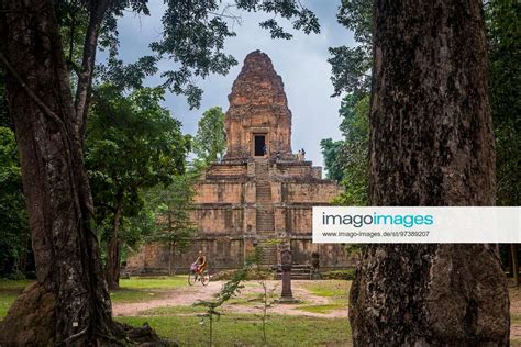 Woman Biking Baksei Chamkrong Temple Angkor Archaeological Park