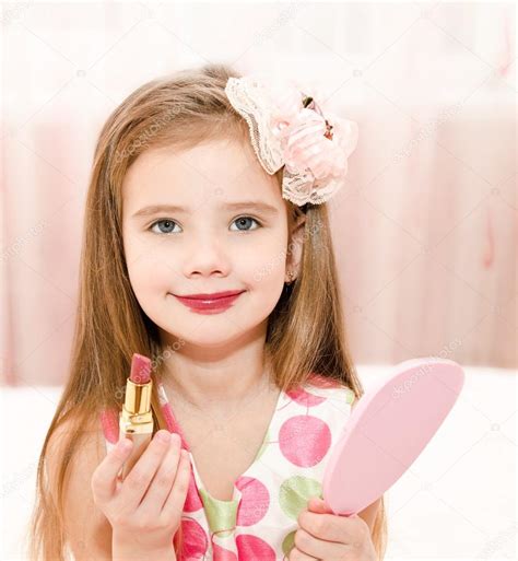 Cute Little Girl With Lipstick And Mirror — Stock Photo © Svetamart