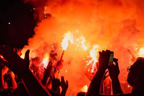 Fans Burn Red Flares At Rock Concert Cheering Crowd At Concert Fire