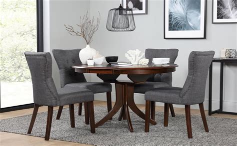 For more relaxed and classic styles, our dining room tables and chairs in wood are perfect whilst our tables and bench. Hudson Round Dark Wood Extending Dining Table and 6 Chairs ...