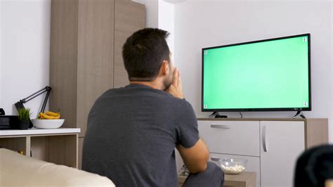 Man Watching Big Green Mock Up Screen Tv In Stock Footage Sbv 327392708