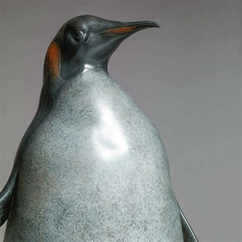 Man photographing a large group of emperor penguins ( aptenodytes forsteri ) on an antarctic ice shelf. Emperor Penguin - Life-size bronze sculpture by Nick Bibby