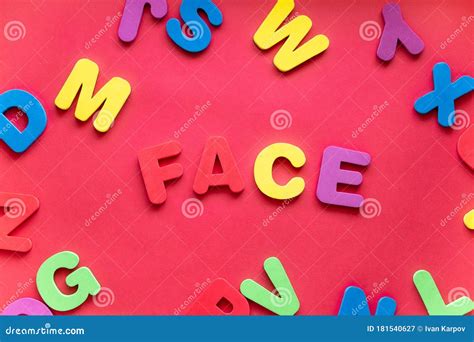 Word Face From Plastic Magnetic Letters On Red Background Stock Image