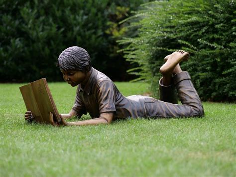 Remember to keep this in mind when searching. Bronze Sculpture Boy Lying Down Reading Book serene garden ...