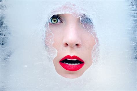 Beautiful Young Woman Face In Ice Frozen Winter Beauty With Red Lips