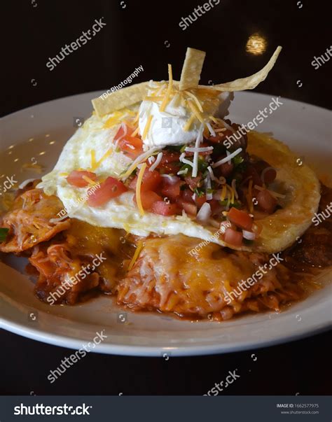 Mexican Chilaquiles Plate Shown Vertical Stock Photo 1662577975
