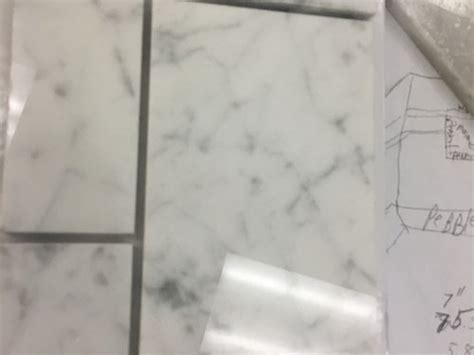 Clean the grout lines 20 to 30 minutes after filling or when the joints begin to harden and dry. Grout color for white carrera marble tile in shower