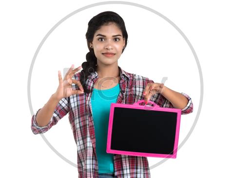Image Of Young Indian Girl Showing A Slate Board And Pointing The Empty