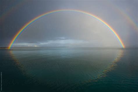 Double Rainbow Over The Ocean In The Early Morning By Stocksy