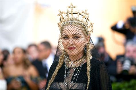madonna exposes fan s breast onstage during concert cnn