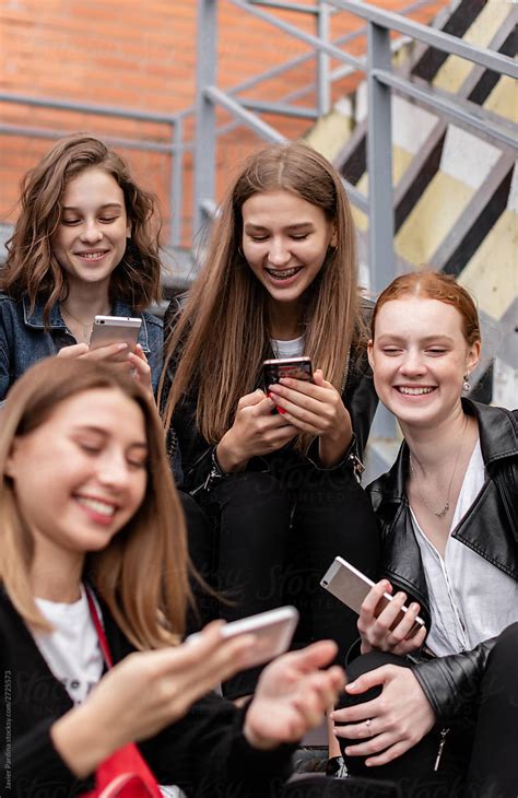 Teen Girls With Phone By Stocksy Contributor Javier Pardina Stocksy