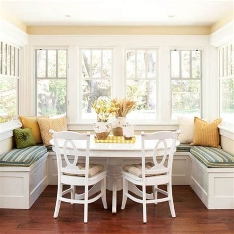 Black and white art gallery on a shiplap dining room wall adds a custom homey appeal. Dining table + window seat | For the Home | Pinterest