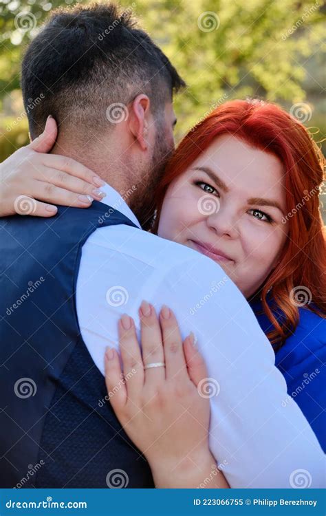Woman Hugs Her Beloved Man Looking To A Camera Stock Image Image Of
