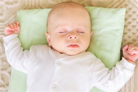 Cute Newborn Baby Sleeping In Bed — Stock Photo © Petrograd99 19417031