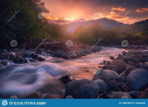 Beautiful Sunset Over Fast Flowing Mountain River Stock Photo Image