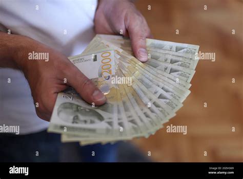 Male Hands Holding A Pile Of Money Serbian Dinar Paper Currency 2000