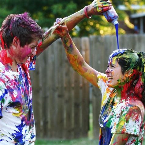 Pin By Stevie On Engagement Photos Paint Fight Couple Paint Fight Color Wars