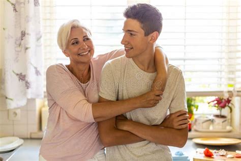 Mother Hugging Her Teenage Son Stock Image Image Of Life Love