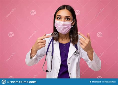 doctor wearing medical mask and stethoscope isolated on background and explaining information