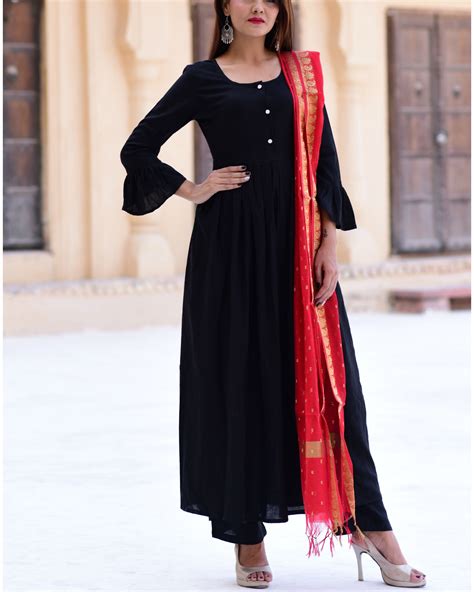 The plain salwar suits come in a wide selection that takes care of children, teenagers, and adults. Black suit set with bordered red dupatta by Thread and ...