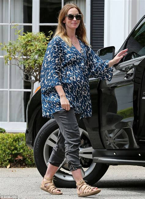 Emily Blunt Covers Baby Bump In Colorful Blouse With Cropped Bottoms In