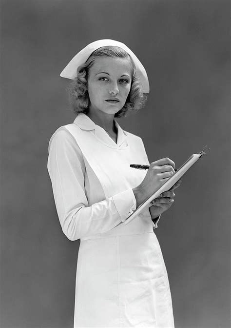 vertical photograph 1930s 1940s serious blond woman nurse by vintage images vintage photos