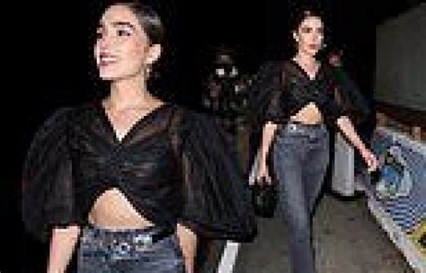 Olivia Culpo Bares Her Toned Midriff In A Black Crop Top While Out In
