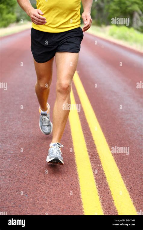 Running Man Runner Closeup Of Running Shoes Of Male Legs Jogging Outdoors On Road Stock Photo