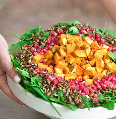 Roasted Sweet Potato Salad With Spinach Pomegranate And Pumpkin Seeds