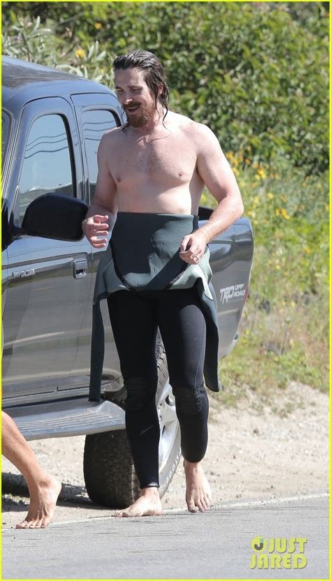 christian bale shows off his shirtless body at the beach christian bale shirtless paddle