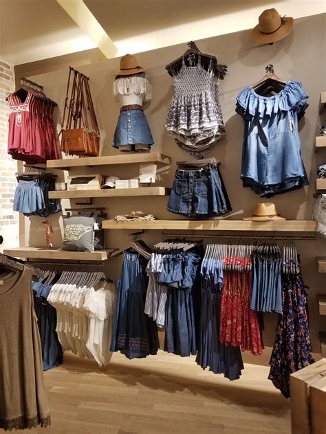 Red, white, and blue wall! | Clothing store displays, Clothing store design, Clothing displays