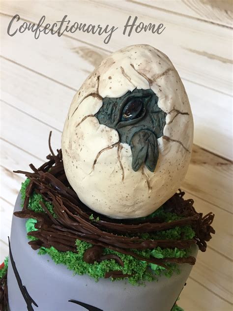 Hatching Dinosaur Egg Cake Topper In A Nest The Dino Egg Is Made Of