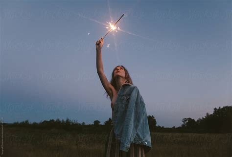 Topless Woman With Sparkler In Countryside By Stocksy Contributor Sergey Filimonov Stocksy