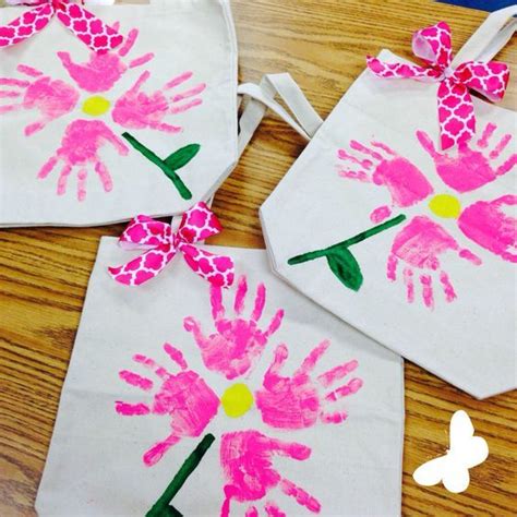 Handprint art flowers a personalized cutie craft that she will keep and treasure for a lifetime!!! 10 Cute Homemade Mother's Day Gifts For Kids to Make