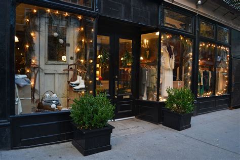 This Is My Kind Of Storefront Boxwoods Light Strands And Wood Door