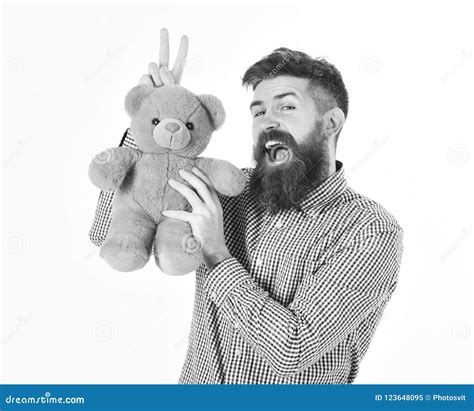Hipster With Beard Or Father Plays With Teddy Bear Or Plush Toy Fatherhood Concept Stock Image