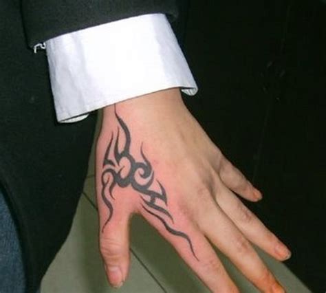 Small stylish hand tattoos for men. tribal hand tattoos Hand Tattoos for Men | Tribal hand ...