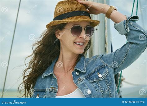 Woman Relaxing On Sailing Boat Enjoying Summer Vacation Stock Photo
