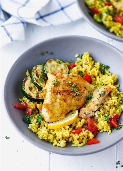 In this boneless chicken thigh recipe, the meat marinates with lemon juice, tomato paste, coriander, and garlicky toum. Turmeric Chicken And Rice in a bowl | Recipes, Dinner ...