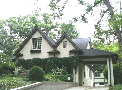 Go with a dark blue grey like the farrow & ball color suggested above. Pretty Old Houses: House Colors: Painted Brick with Dark Trim
