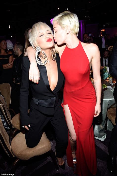 Miley Cyrus Puckers Up For A Kiss With Rita Ora At Pre Grammys Bash