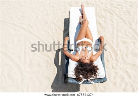 Relaxed Youthful African Woman Sunbathing On Stock Photo 675341374