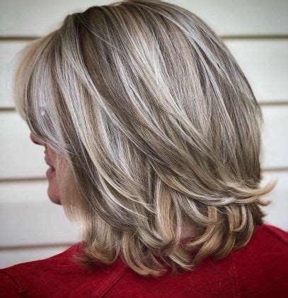 Even when not worn glamorously over one shoulder, this longer style looks beautiful thanks to polished layers. 80 Best Hairstyles for Women Over 50 to Look Younger in 2021